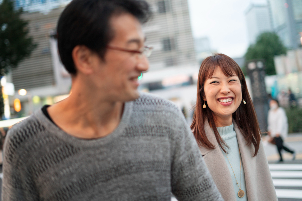Man with his wife walking around town