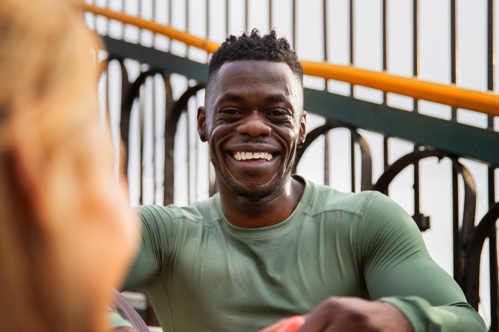 african american man happy outside talking to friends in greenville sc